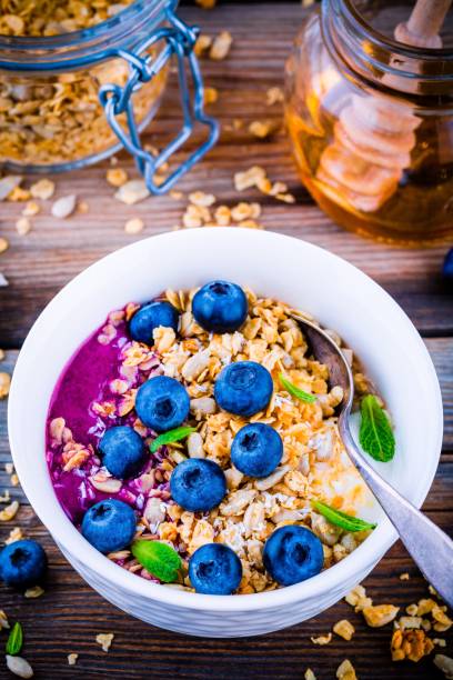 istock Yogurt with granola and blueberry sauce, fresh blueberries and mint 658104522
