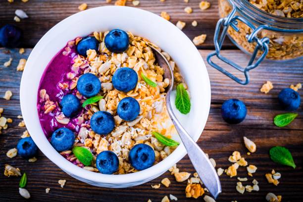 istock Yogurt with granola and blueberry sauce, fresh blueberries and mint 658104566