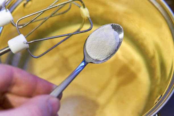 istock Preparing the dough, add the ingredients with a spoon 658118898
