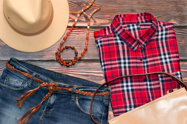 istock Red check shirt, jeans, leather hat, bag and belt 658119354