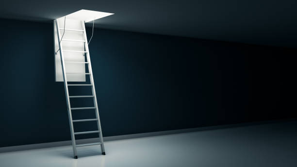 istock Wooden ladder to the attic with light. 658125934
