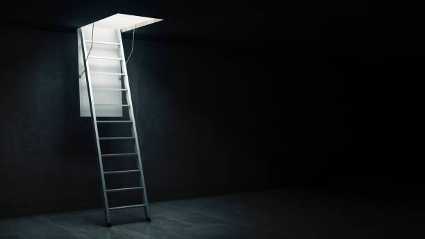 istock Wooden ladder to the attic with light. 658125984