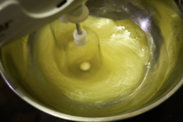 istock Preparing the dough, add the ingredients with a spoon 658126210