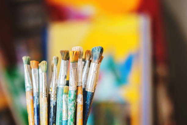 istock Paint Brushes isolated in colorful backgraund, close-up 658129632
