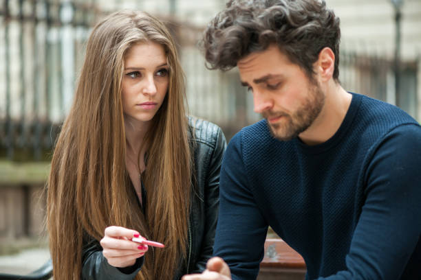 istock Disappointed couple looking at pregnancy test. 658130474