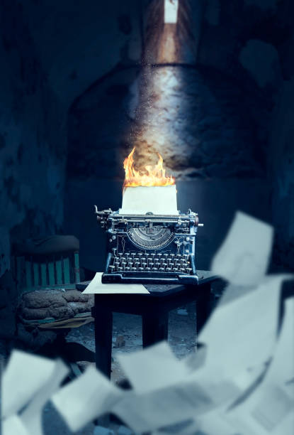 istock Old typewriter with burning sheet of paper 658137814