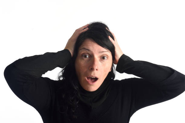 istock surprised woman on white 658140926