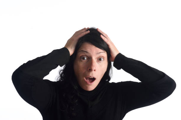 istock surprised woman on white 658140928