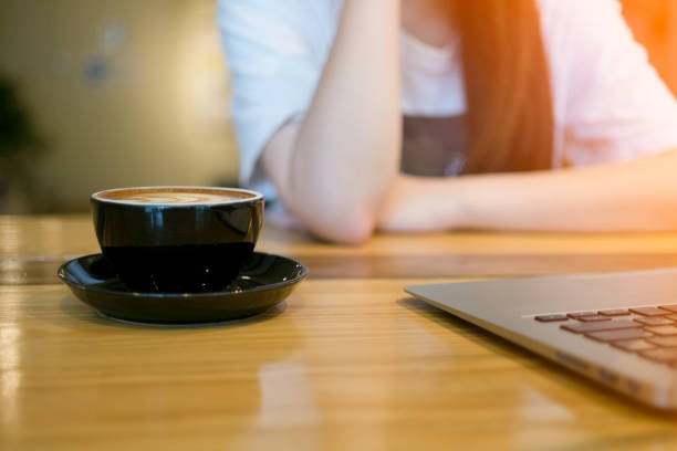 istock Woman using computer laptop in coffee shop 658141996