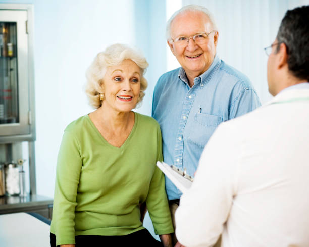 istock Senior couple talking with doctor. 658152140