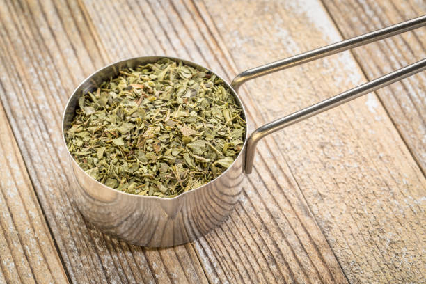 istock scoop of oregano leaf 658152216
