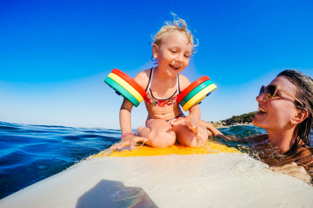 istock Little girl on surfboard 658152232