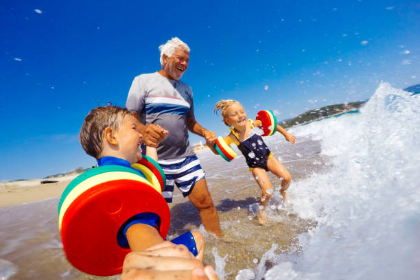 summer vacation with grandpa - summer swimming beach vacations imagens e fotografias de stock