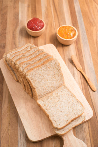istock slices bread with jam on wooden table 658157464
