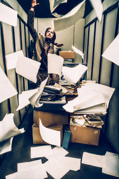 Concept image of a Stressful day in a tiny Office of a Magazine editor