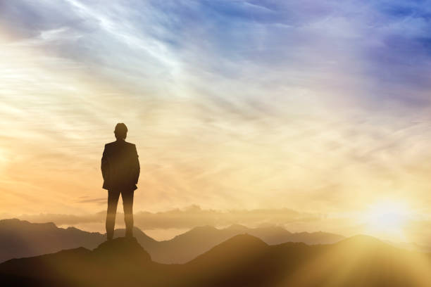 istock Businessman silhouetted against evening skies. 658167850
