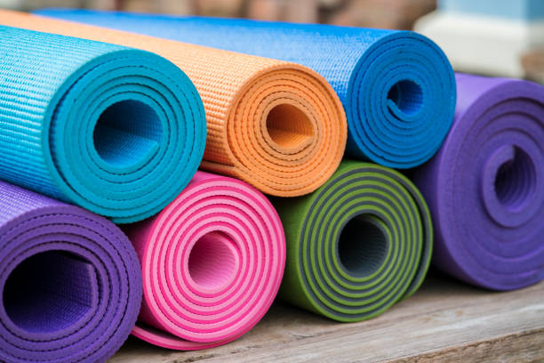 istock colorful yoga mats on the table 658171014