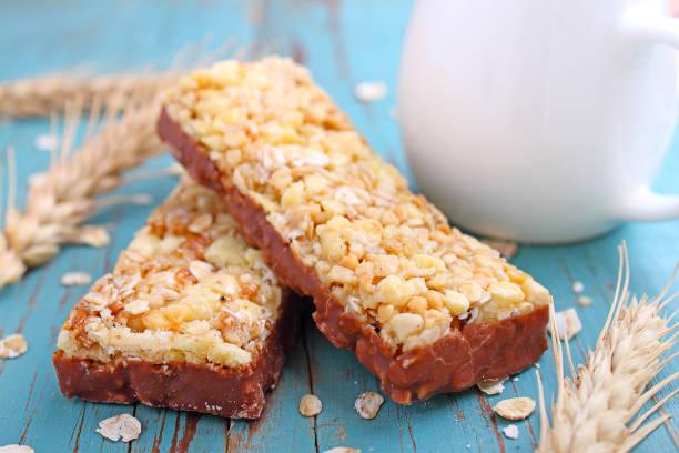 muesli bars with raisins and nuts on a blue background