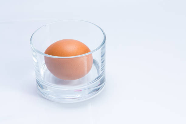 istock Egg in glass isolated on white background 658173794