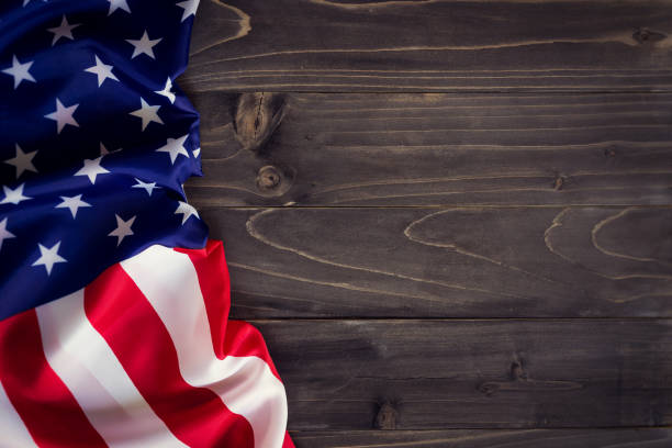 istock USA flag on wooden wall background and texture with space 658174370