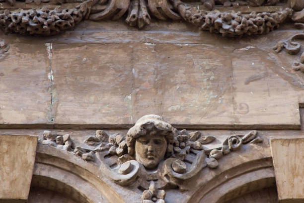 istock Brown architecture detail with human head 658175646