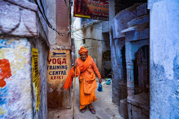 sadhu, an indian holy man - walking outdoors footpath single lane road imagens e fotografias de stock