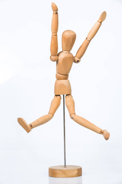 istock Wooden figure stand isolated on white background 658184266