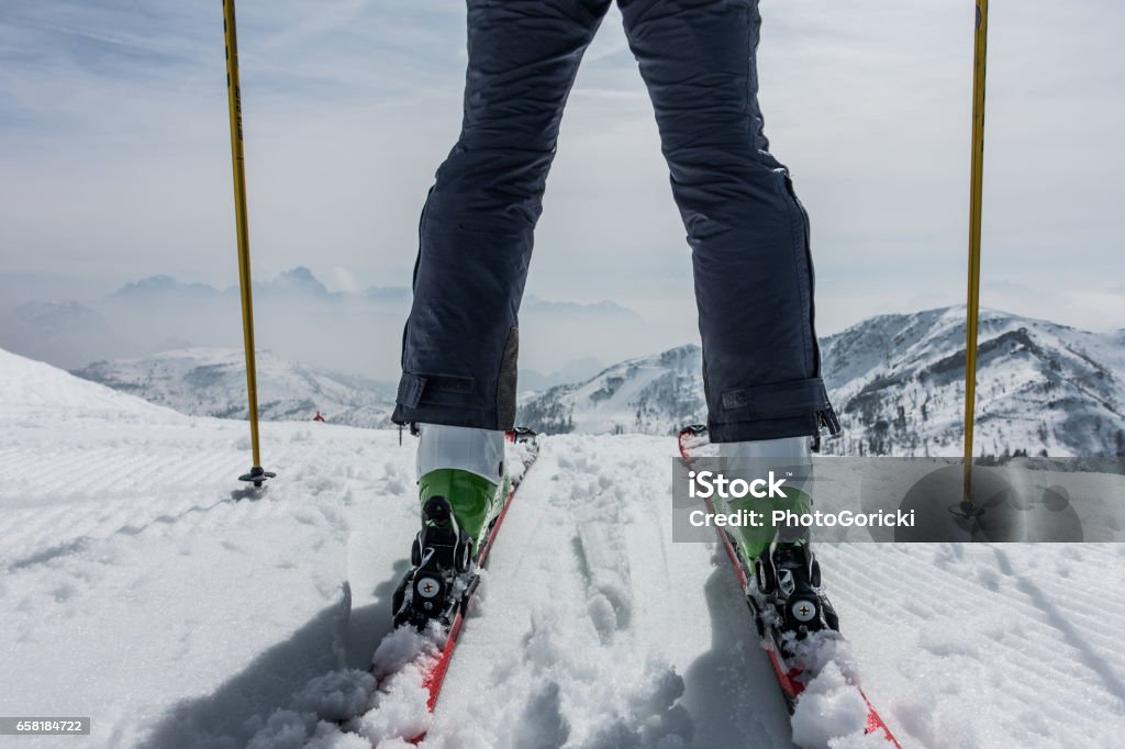 Skier and mountains Wide angle shot of skier and mountains Ski Boot Stock Photo