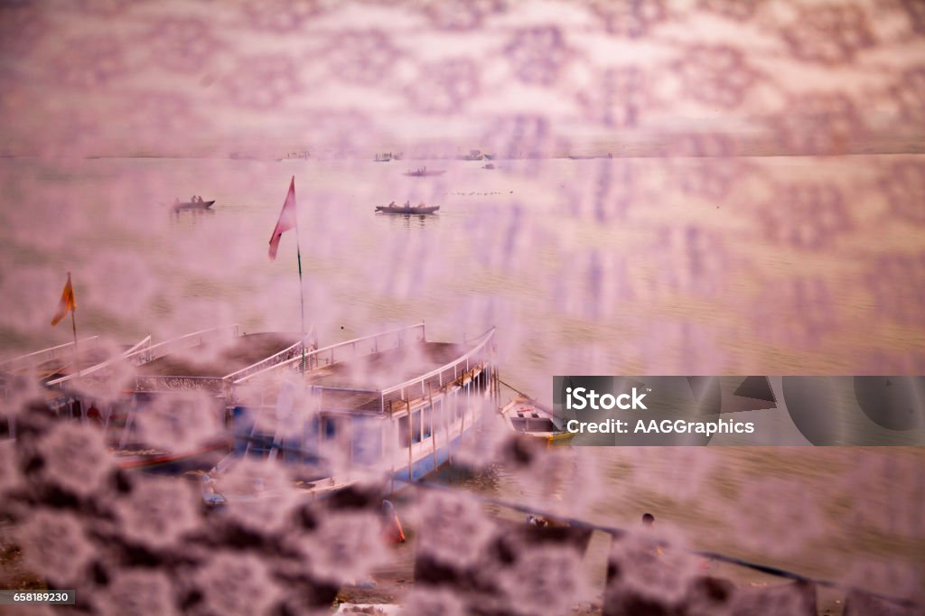 Boats are floating in calm water in evening time Varanasi, India - December 13, 2015 : Boats are floating in calm water in evening time, varansi ,uttar pradesh,india. Asia Stock Photo