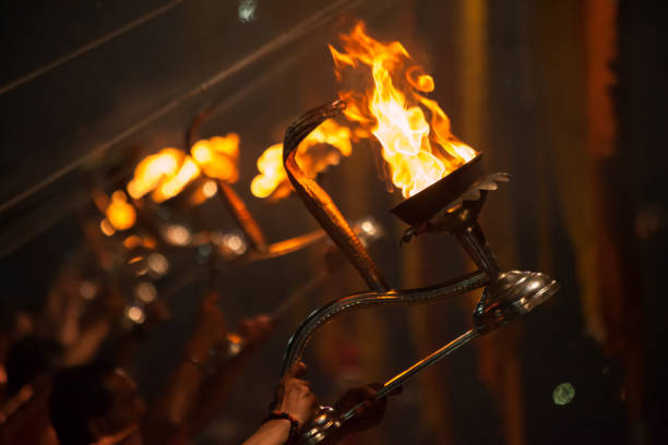Hindu priests perform an arti - worship ceremony at Ganges River