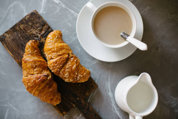 istock Croissants and cup of coffee 658201388