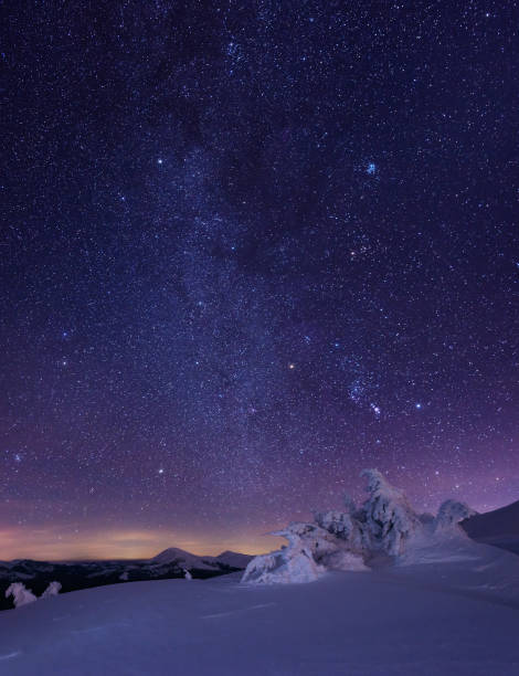istock Night starry sky in winter mountains 658201478