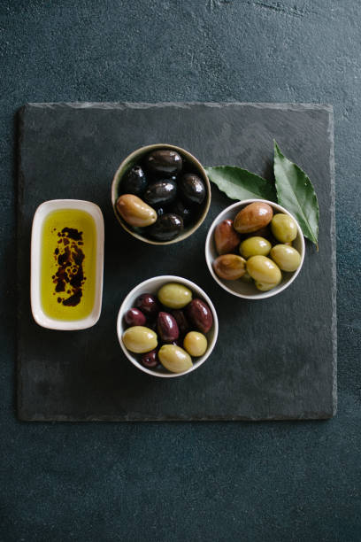 istock Olives different colors and olive oil 658201664