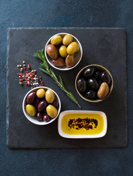 istock Olives different colors and olive oil 658201700