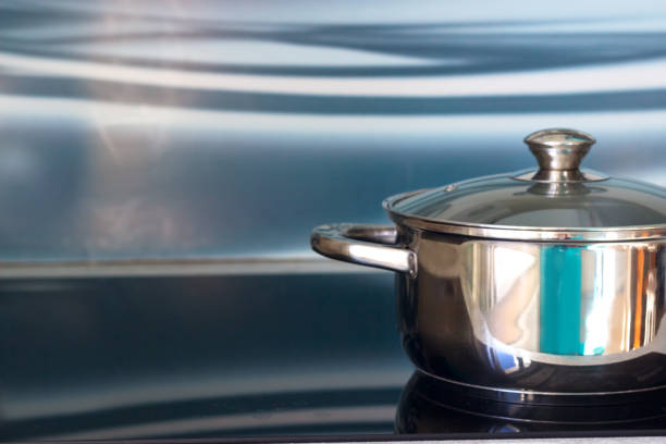 istock Big pot in modern kitchen with induction stove 658214204