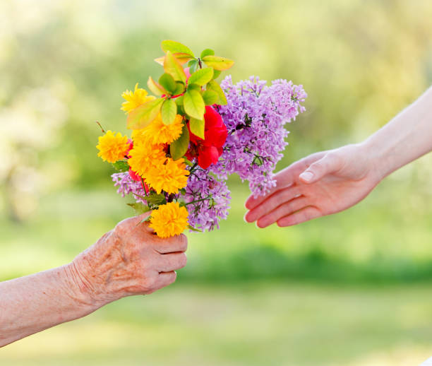 istock Bouquet flowers in hands 658220338