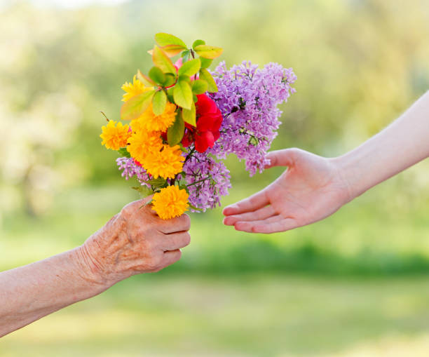 istock Bouquet flowers in hands 658221230
