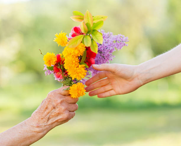 istock Bouquet flowers in hands 658221254