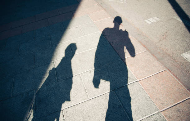 istock Shadows of two people 658229506