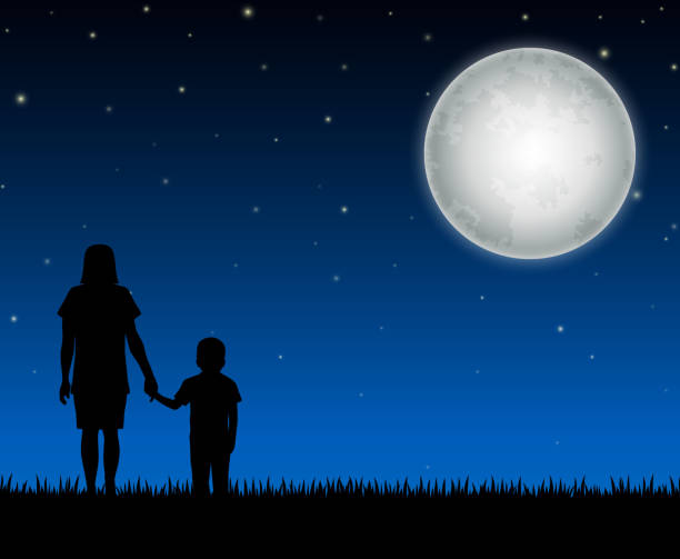 istock Silhouette of mother and child on the night background 658230710