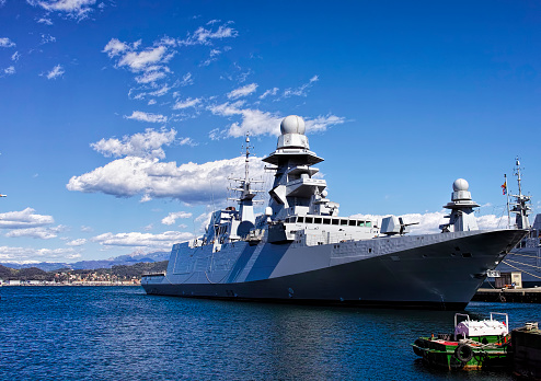 military ship in a harbour in italy