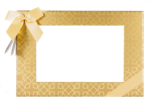 istock Golden Gift box with ribbon and transparent face frame over white 658260104