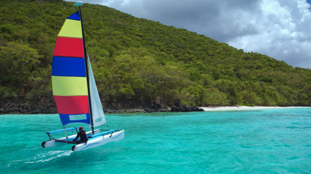 istock young man sailing catamaran close to shoreline 658267658