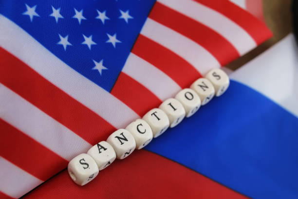istock russian and usa flag sanctions 658270476