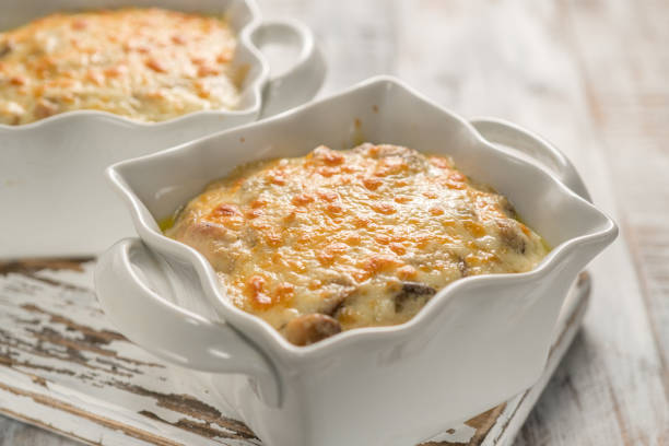 istock Baked gratin casserole chicken with mushrooms with cheese 658273306