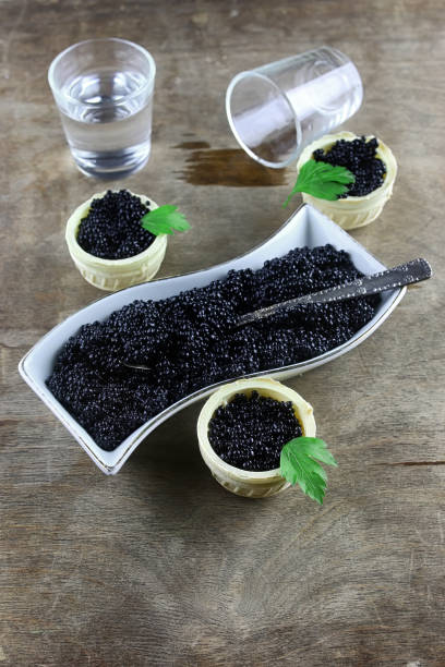 istock black caviar on a wooden background 658273314