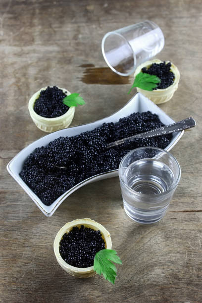 istock black caviar on a wooden background 658273390