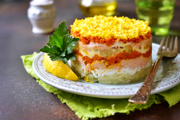 Layered salad with vegetables and salmon 