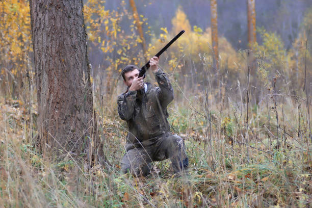 istock man hunter outdoor in autumn hunting 658275110