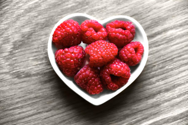 istock Berries: rasberries on a wood background 658275198
